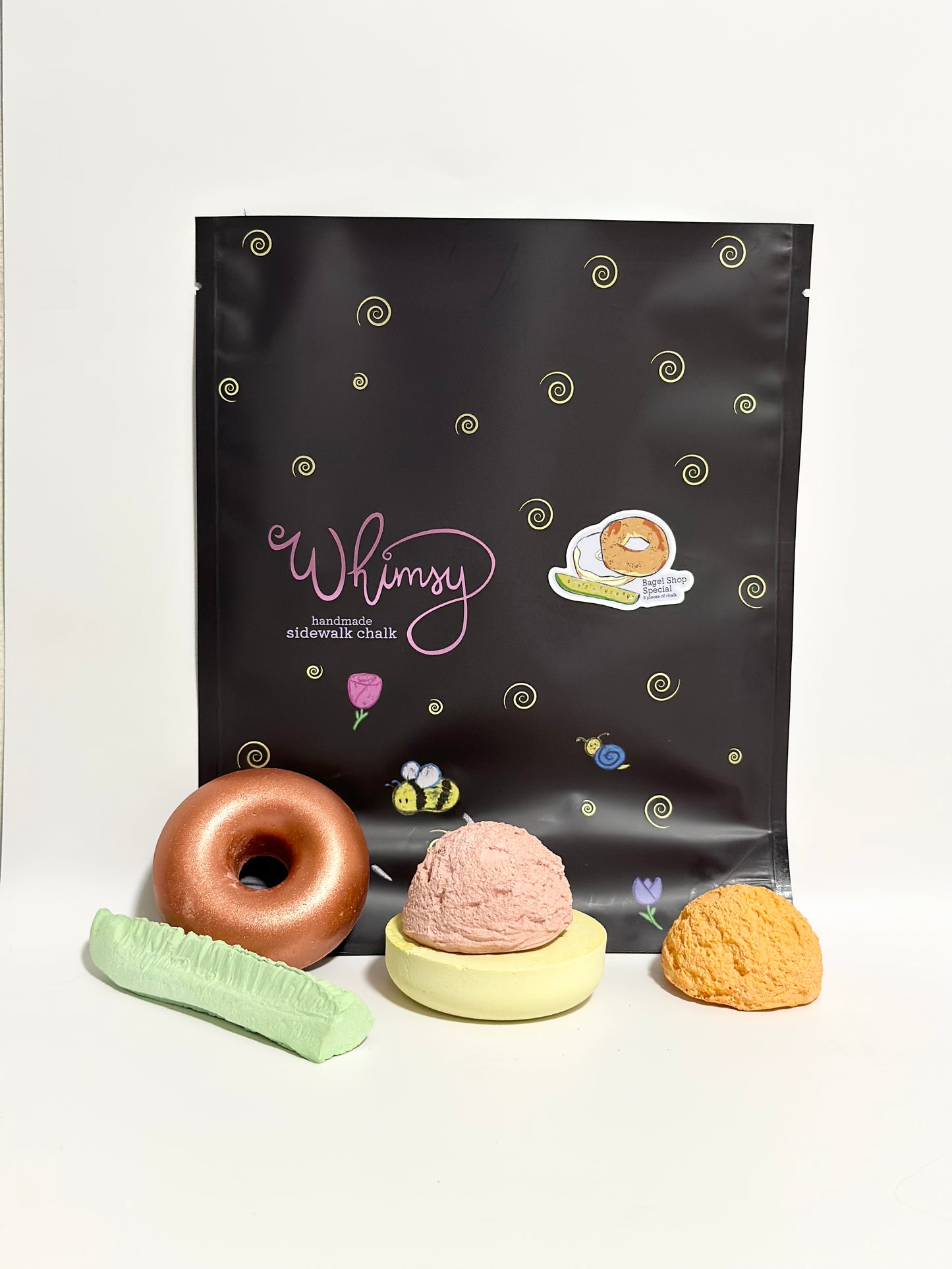Handmade sidewalk chalk plain bagel and pickle packaging, art